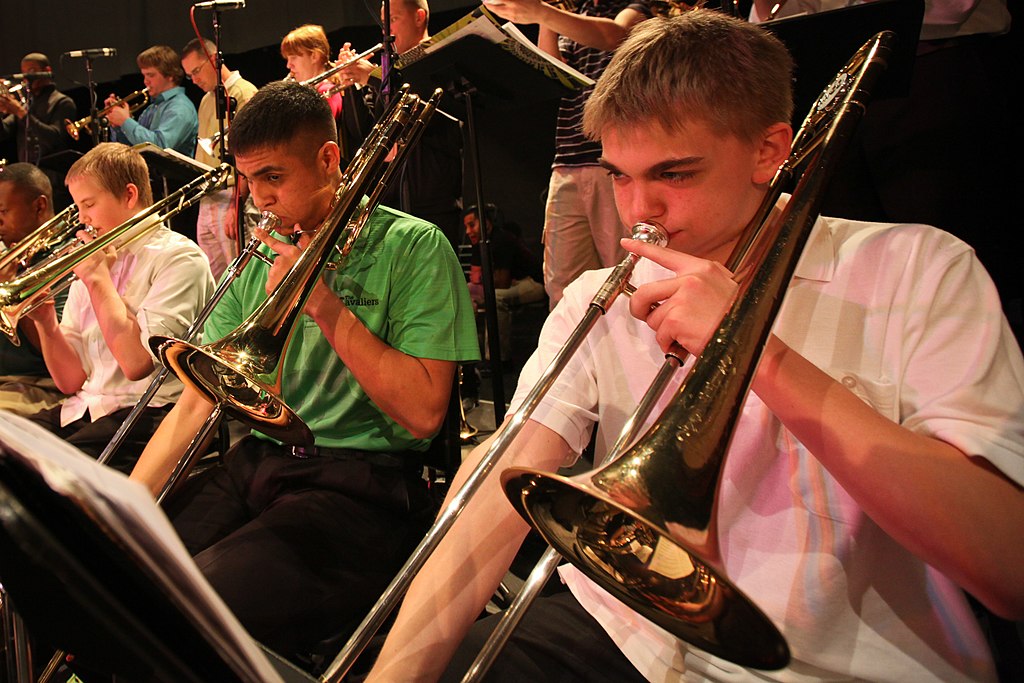 Nick Navarro, a trombonist in the Marine Corps All Star Jazz Band, plays with band students